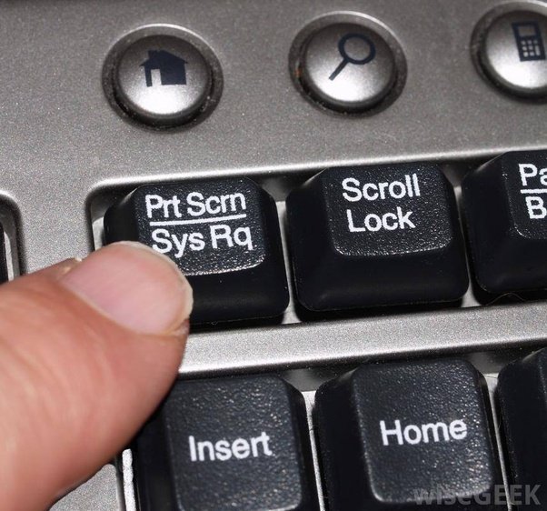 Finger pressing Print Screen key on computer keyboard